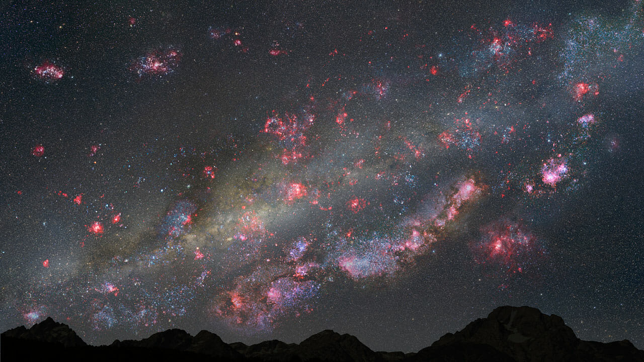 This illustration depicts a view of the night sky from a hypothetical planet within the youthful Milky Way galaxy 10 billion years ago. The heavens are ablaze with a firestorm of star birth; glowing pink clouds of hydrogen gas harbour countless newborn stars, and the bluish-white hue of young star clusters litter the landscape.