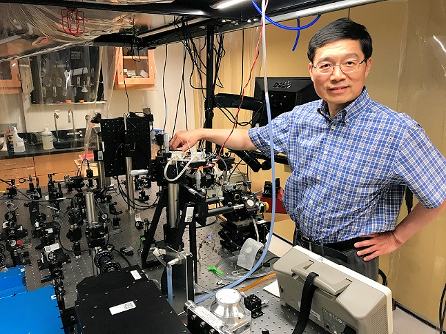 Professor Lihong Wang with 100 Billion FPS ultrafast camera 